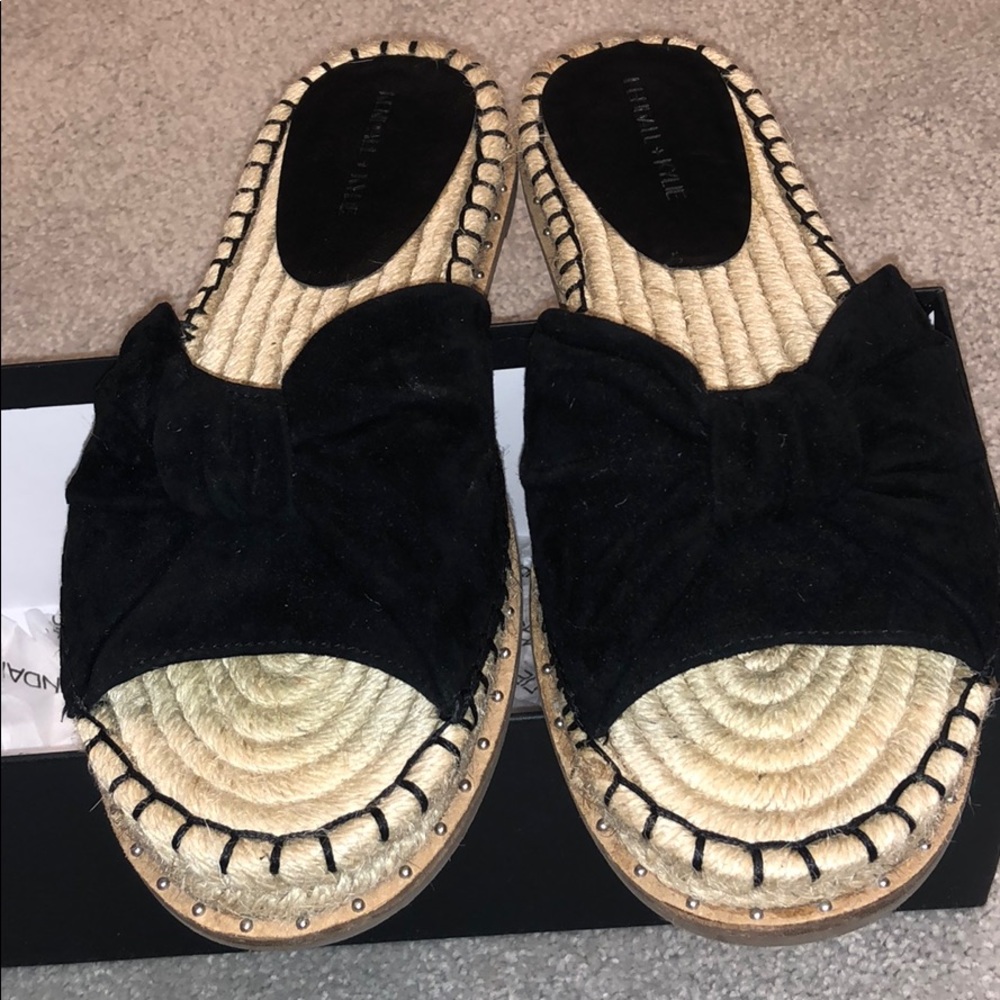 Suede bow espadrille slides with studded detail.